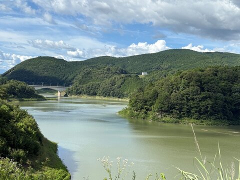 Summer view of Agigawa Lake and forested hills in Ena, Gifu