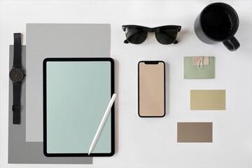 Minimal flat lay workspace with tablet, phone, sunglasses, coffee cup © Rawpixel.com