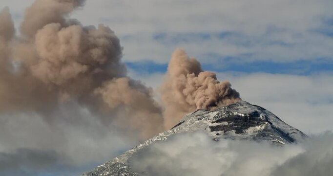 Cotopaxi Volcano, Ecuador, erupting, 12th of May 2023,. Volcanic ash is erupting from the crater. At 5897m altitude one of the world's highest active volcanoes.