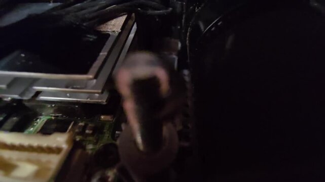 Hanging wire harness cables above corroded PCB screw hole and mounting post.