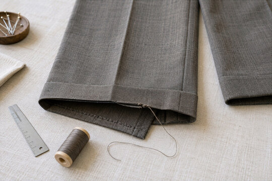 Loose trouser hem displayed for assessment