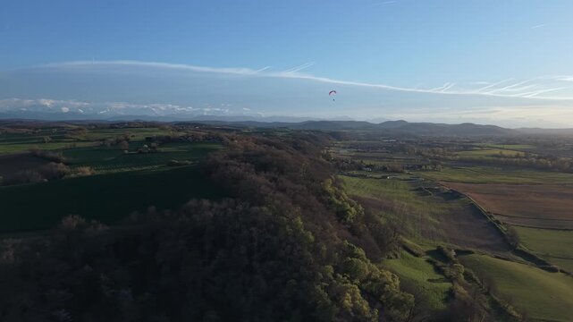 Aerial view of French countryside with a paraglider