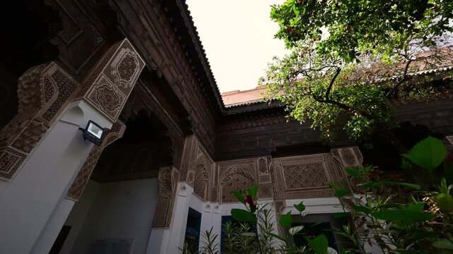 Marrakech, morocco. August 10, 2026. Ornate details of a traditional riad in marrakech, morocco. Beautiful islamic architecture surrounds a serene courtyard with lush green plants