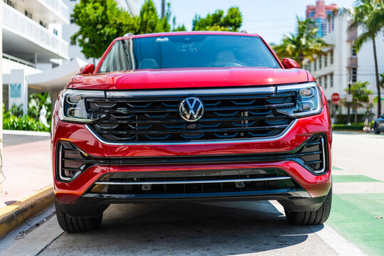 Miami, Florida, USA - May 13, 2025: Volkswagen Atlas or Atlas Cross Sport 2024 crossover SUV car. Luxury crossover car Volkswagen Atlas. Car Volkswagen Atlas parked outdoor. Red car, corner view