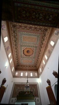 Marrakech, morocco. August 10, 2026. Beautiful interior of a traditional moroccan building in marrakech. Intricate zellij mosaic patterns and geometric designs adorning the ceiling
