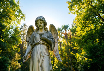 Fototapeta premium Spirituality and peace, stone angel statue in a sunlit forest garden for memorial and funeral themes with soft natural light and serene atmosphere