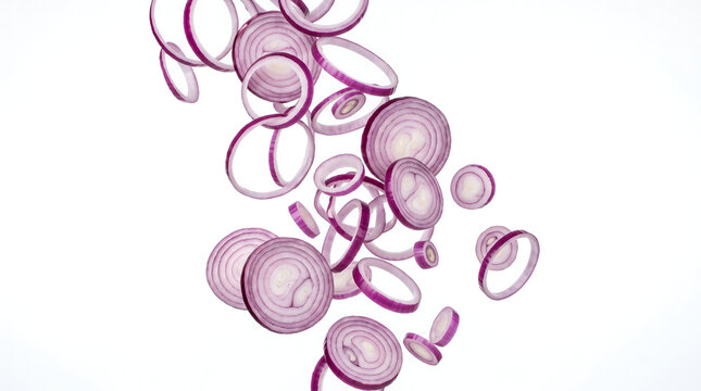 Fresh red onion slices falling isolated on white background
