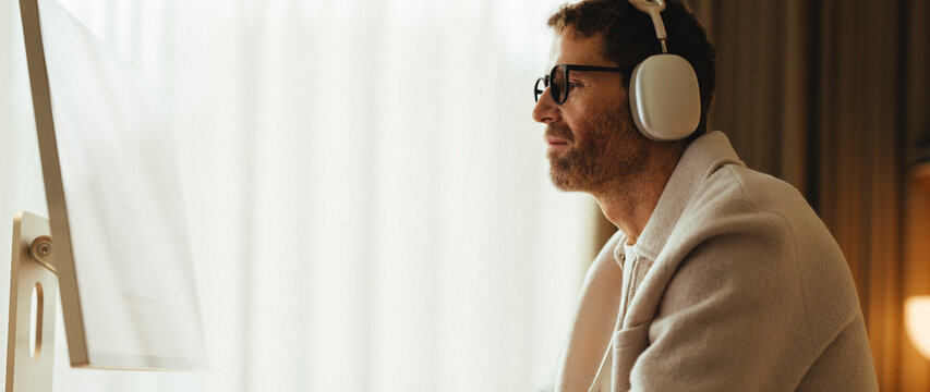 Focused mature professional doing deep work at computer