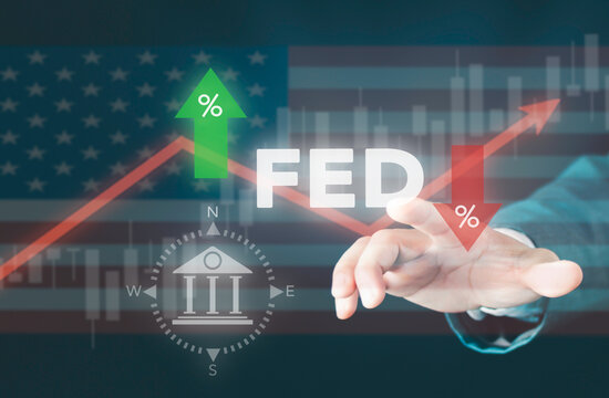 Businessman touching FED interest rate change concept. Federal reserve rate cut and hike, central bank policy, stock market growth graph, percentage arrow, and US economy.