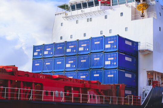 Alesund, Norway - September 5, 2026, Tank container and freight containers aboard the FREYA W cargo vessel