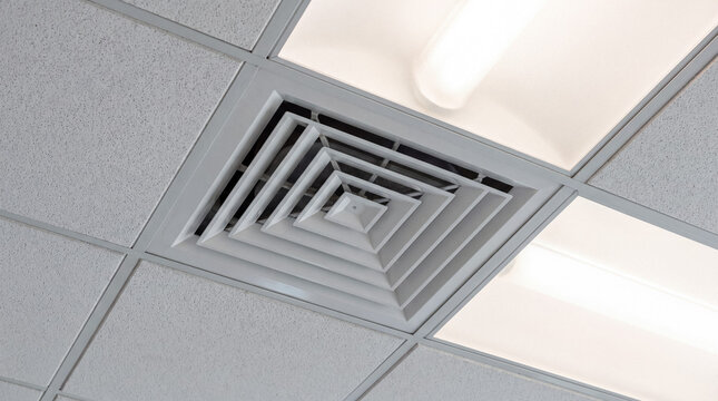 Air vent in acoustic panel ceiling providing ventilation and air conditioning for comfortable indoor climate
