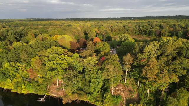 Aerial over Berrien Springs, in Berrien County, within Oronoko Charter Township, Michigan, United States. A rural community. Approaching from Lake Chapin, a dammed lake along the St. Joseph's River.