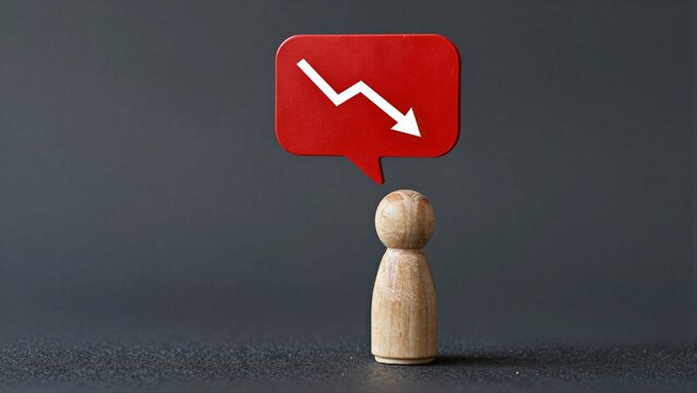Wooden figure beneath red downward arrow, symbolizing decline or negative trend.