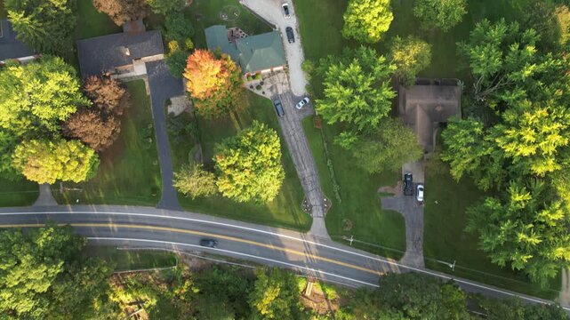 Aerial over Berrien Springs, in Berrien County, within the Oronoko Charter Township, Michigan, United States. Rural community with farms and lakeside home and vacation properties. Overhead shot.