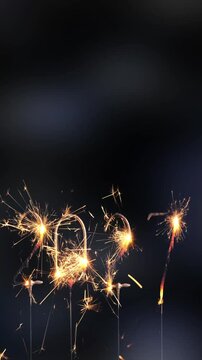 burning sparklers 2027 new year isolated on blurred dark background, digital happy new year greeting card for social media with copy space