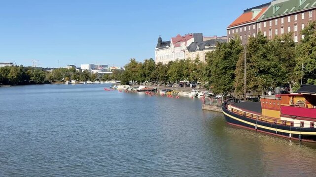 Moored Boats Along a Calm City Canal in Early Autumn