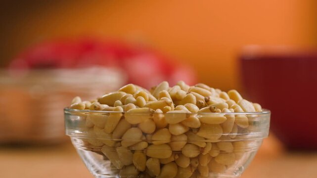 Pine Nuts Eaten by a Man, Person Cracking and Enjoying Fresh Cedar Pine Nuts as a Healthy Organic Snack