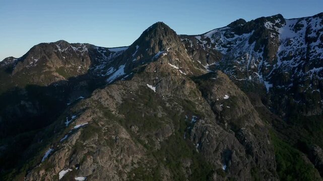 Aerial view of forested mountains and rural valley landscape