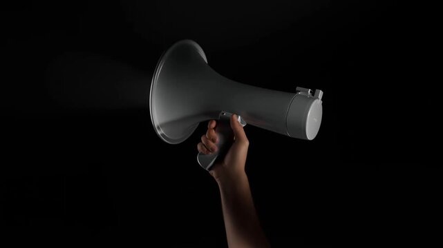 Hand Holding Megaphone Loudspeaker in Studio Against Black Background