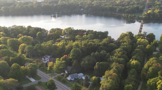 Aerial over Berrien Springs, in Berrien County, within the Oronoko Charter Township, Michigan, United States. Approaching Lake Chapin, a dammed lake along the St. Joseph's River.