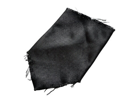 Ripped black fabric with frayed edges creates a dynamic abstract texture against transparent background.