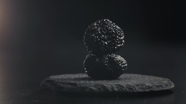 Truffle mushroom, Fresh Black Truffles on Rustic Wooden Board, Gourmet Delicacy, Luxury Culinary Ingredient, Close Up Macro Video for Restaurant and Cafe Menu
