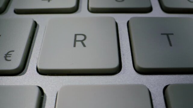 A detailed closeup shot of a sleek and modern computer keyboard showing the keys distinctly