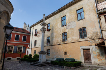 Fototapeta premium Inner courtyard of Armenian Cathedral with decorative column, Lviv, Ukraine