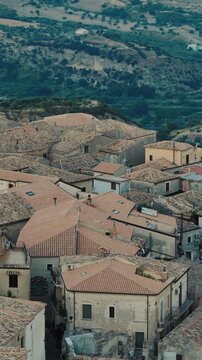 Aerial view of the houses in the city of Gerace at night after sunset in italy