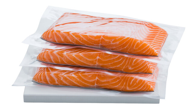 Fresh raw salmon fish fillets in vacuum sealed plastic packaging