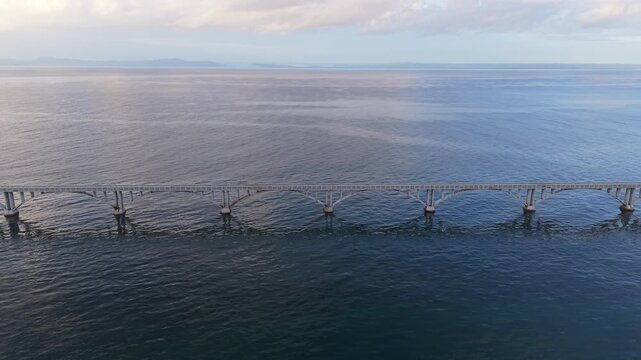 Aerial View of Samana Pedestrian Bridge Extending Across Calm Caribbean Sea