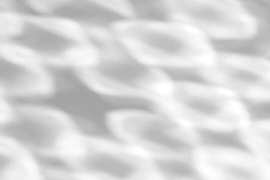 Real soft caustic ripple shadow cut out on a transparent png background with blurred diamond-shaped light patterns. Suits a serene wellness mockup overlay, a retro disco and design-use workflow as.