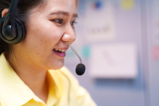 Customer Service Assistant Wearing Headset at Call Center