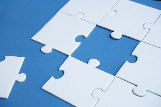An incomplete puzzle, with some pieces missing, symbolizes incompleteness, imperfection, mystery, or loss. Concept of finding solutions and problem-solving.

