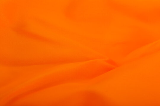 Orange fabric texture as a background.