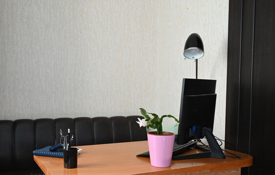 Indoor desk with computer and supplies