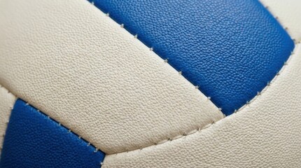 Fototapeta premium Close up macro view of the textured surface of a blue and white volleyball with visible stitching