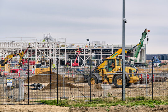 Infrastructure development and industrial construction site with heavy machinery and steel framework at the Google Datacenter extension in Taulov Denmark