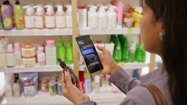 Young Hispanic woman holding cosmetic serum bottle while scanning ingredients with AI assistant app on smartphone. Ideal for smart retail and digital shopping advertising