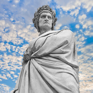 Statue of famous medieval Italian poet Dante Alighieri in Piazza Santa Croce in Florence city - Tuscany, Italy - More than 100 years old - copy space concept