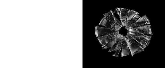Shattered glass bullet hole with radial cracks on black background, broken glass texture, realistic impact splinter effect for crime and accident scenes © PNG