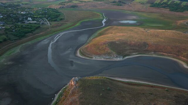 Aerial view showcasing extreme water depletion in the Varatic reservoir and riverbed area. Moldova