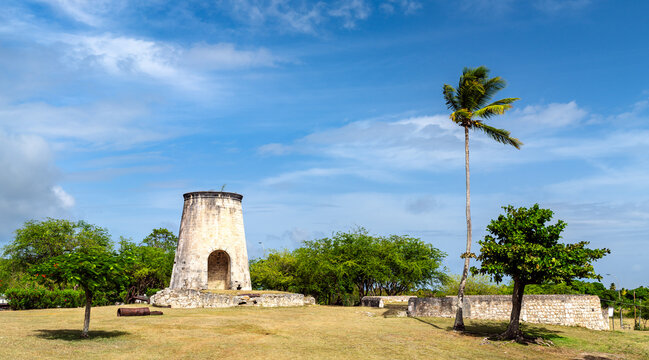 Stone sugar cane windmill ruin at Habitation Murat under a blue sky in Grand-Bourg, Marie-Galante, Guadeloupe, Caribbean France