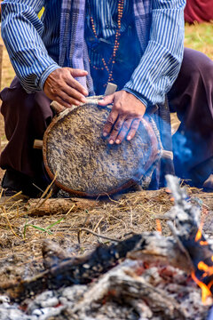 Creole drum being played beside a bonfire in the interior of Minas Gerais state.