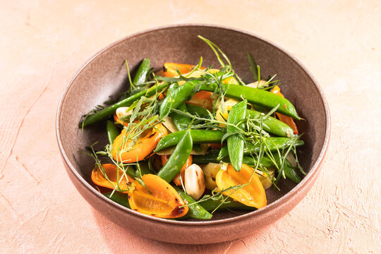 Grilled colorful vegetable : bell pepper, pea pods, carrots, over concrete background. Top view with copy space.