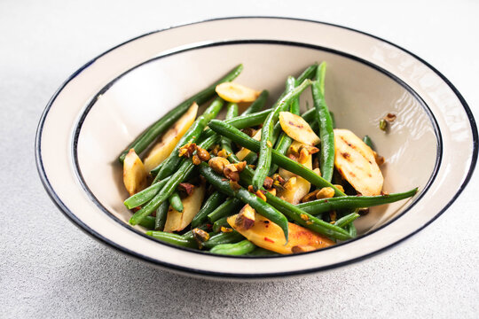 Garlicky Homemade Sauteed Green Beans with nuts and grilled carrots