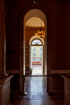 View looking outside through ornate arched doorways from the interior of Teatro Amazonas in Manaus, Brazil