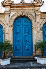 Ornate colonial architecture with striking blue wooden doors in Salvador da Bahia, Brazil © Marco Olivetti