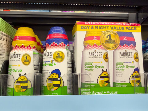 Frisco, Texas, USA - August 31th, 2026: Zarbees childrens nighttime cough syrup bottles and day night value pack boxes arranged on shelf in Walmart pharmacy shelf