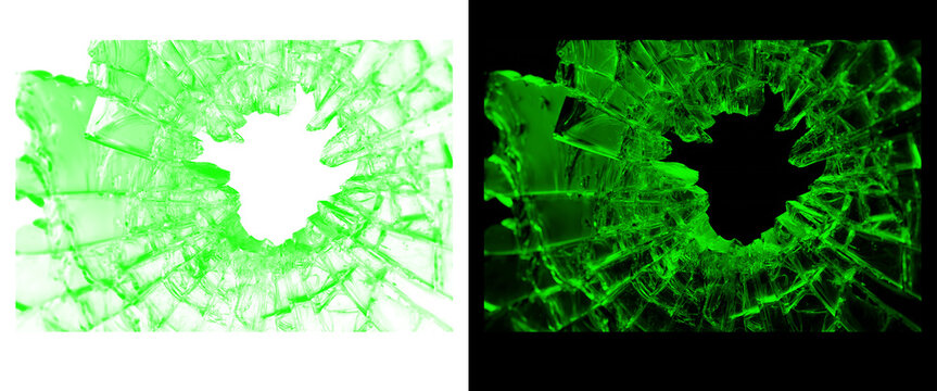 Shattered green glass texture with hole, broken tempered glass shards on black and white background, glowing emerald cracked glass overlay